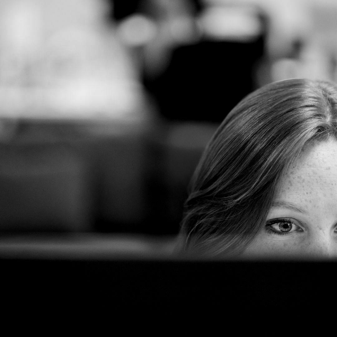 A woman looking at a computer screen